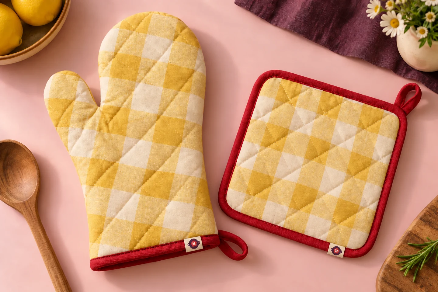 Butter-and-cream gingham oven mitt and pot holder with cherry binding and small woven seam labels